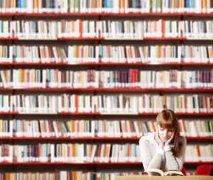 Young student reading book